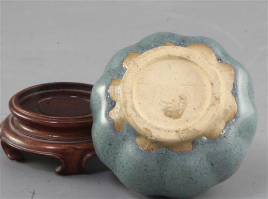 A Chinese Jun-type lobed ovoid vase, 17th/18th century, height 6cm, wood stand